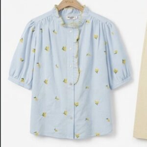 Camisa flor amarilla